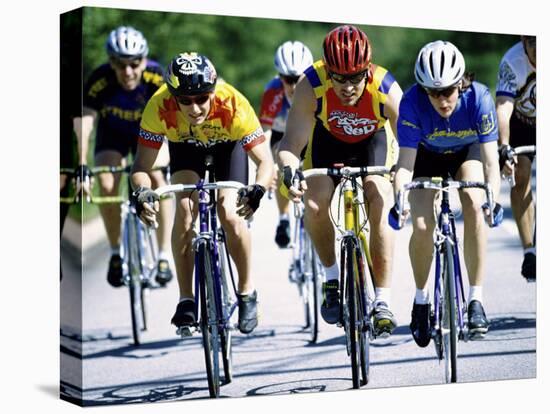 Group of Cyclists Riding Bicycles-null-Stretched Canvas