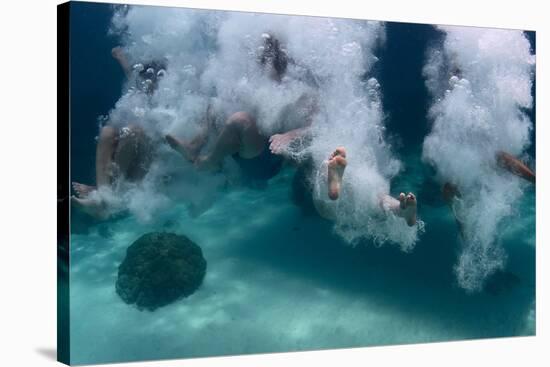 Group of Friends Having Fun by Jumping into Sea-Dudarev Mikhail-Stretched Canvas