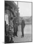 Group of people outside a Metropolitan Line railway station, London, 1930s-Bill Brunell-Mounted Photographic Print