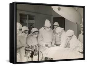 Group of Student Nurses in Theatre Observing a Surgeon Performing an Operation-null-Framed Stretched Canvas