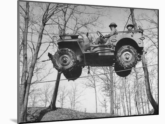 Group of Us Soldiers Pulling a Jeep over a Ravine Using Ropes while on Maneuvers-William C^ Shrout-Mounted Premium Photographic Print