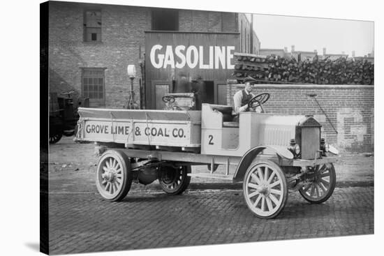 Grove Lime and Coal Company in Front of a Building Sign That Reads Gasoline-null-Stretched Canvas