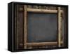 Grunge Blackboard Hanging on Wooden Wall as a Background-Andrey_Kuzmin-Framed Stretched Canvas