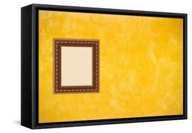 Grunge Yellow or Gold Stucco Wall with Empty Picture Frame-Virtuelle-Framed Stretched Canvas