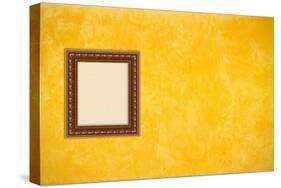 Grunge Yellow or Gold Stucco Wall with Empty Picture Frame-Virtuelle-Stretched Canvas