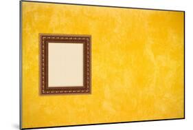 Grunge Yellow or Gold Stucco Wall with Empty Picture Frame-Virtuelle-Mounted Art Print