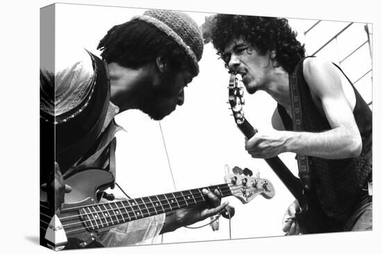 Guitarists David Brown And Carlos Santana During Music And Art Festival In Woodstock, August 1969-null-Stretched Canvas