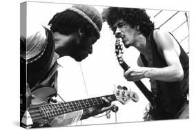 Guitarists David Brown And Carlos Santana During Music And Art Festival In Woodstock, August 1969-null-Stretched Canvas