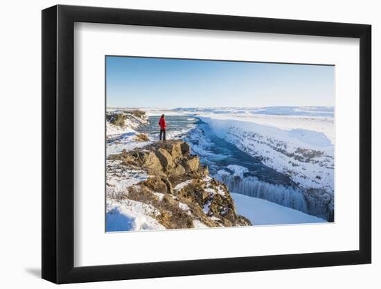 Gullfoss waterfall, Golden Circle, Iceland. Man with red coat admiring the waterfall (MR)-Marco Bottigelli-Framed Photographic Print