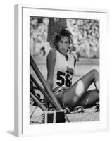 Gunhild Larking, Sweden's Entry for High Jump, Nervously Awaiting Turn to Compete at Olympic Games-George Silk-Framed Premium Photographic Print