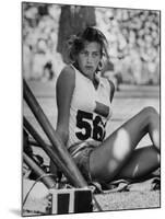 Gunhild Larking, Sweden's Entry for High Jump, Nervously Awaiting Turn to Compete at Olympic Games-George Silk-Mounted Premium Photographic Print