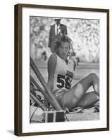 Gunhild Larking, Sweden's Entry for High Jump, Nervously Awaiting Turn to Compete at Olympic Games-George Silk-Framed Premium Photographic Print