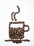 Coffee Beans Falling from Someone's Hand into a Sack-Gustavo Andrade-Photographic Print