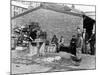 Gutting Fish Outside a Warehouse in Whitby, North Yorkshire, 1959-null-Mounted Photographic Print