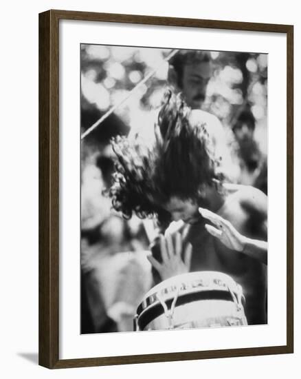 Guy Playing Drums at Woodstock Music Festival-null-Framed Premium Photographic Print