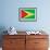 Guyana Flag Design with Wood Patterning - Flags of the World Series-Philippe Hugonnard-Framed Art Print displayed on a wall