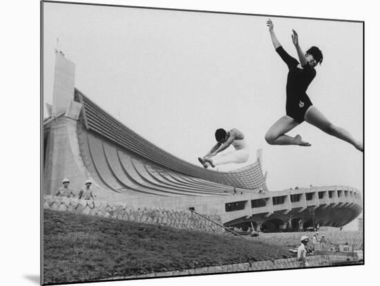 Gymnasts Outside the New Olympic Building in Japan-Larry Burrows-Mounted Photographic Print