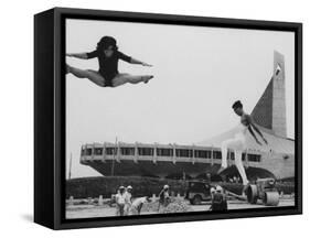 Gymnasts Outside the New Olympic Building in Japan-Larry Burrows-Framed Stretched Canvas