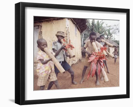 Haitian Children Playing Long Cylindrical Musical Instruments Made of Bamboo-Lynn Pelham-Framed Photographic Print