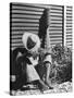 Haitian Native Engaged in a Siesta Next to Giant American Toothbrush Ad He Totes Around the Streets-Rex Hardy Jr.-Stretched Canvas