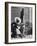 Haitian Native Engaged in a Siesta Next to Giant American Toothbrush Ad He Totes Around the Streets-Rex Hardy Jr.-Framed Photographic Print
