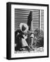 Haitian Native Engaged in a Siesta Next to Giant American Toothbrush Ad He Totes Around the Streets-Rex Hardy Jr.-Framed Photographic Print