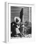 Haitian Native Engaged in a Siesta Next to Giant American Toothbrush Ad He Totes Around the Streets-Rex Hardy Jr.-Framed Photographic Print