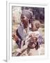 Haitian Woman Smoking a Pipe while Holding a Baby-Lynn Pelham-Framed Photographic Print