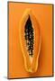 Half a Papaya on Orange Background-Foodcollection-Mounted Photographic Print