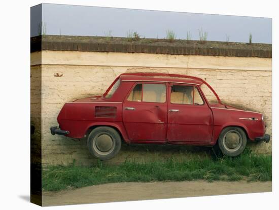 Half a Skoda on a Wall in a Car Salesyard Near Piestany, Slovakia, Europe-Strachan James-Stretched Canvas