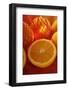 Half an Orange in Front of Oranges in Net-Foodcollection-Framed Photographic Print