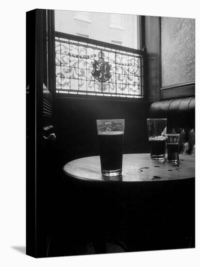 Half Empty Glasses of Beer Left on Table in the Blue Lion Pub in Dublin-Gjon Mili-Stretched Canvas