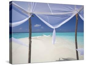 Hammock Hanging in Shallow Clear Water, the Maldives, Indian Ocean, Asia-Sakis Papadopoulos-Stretched Canvas