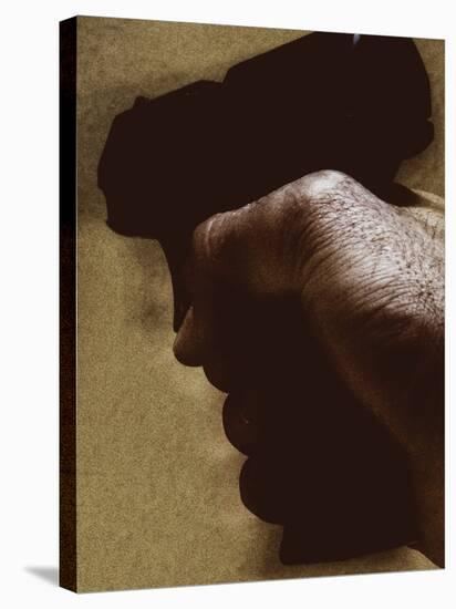 Hand Holding Gun-Torsten Richter-Stretched Canvas