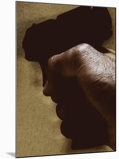 Hand Holding Gun-Torsten Richter-Mounted Photographic Print