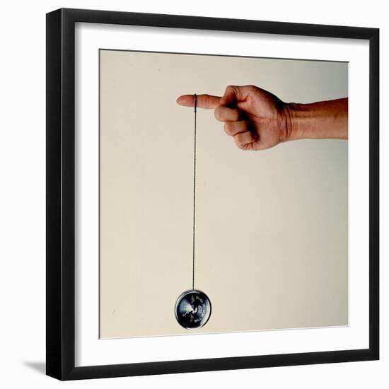 Hand Holding String Attached to Tom Khun Yo-Yos Ltd's High-Tech, Aluminum, Ball Bearing Yo-Yo-Ted Thai-Framed Photographic Print