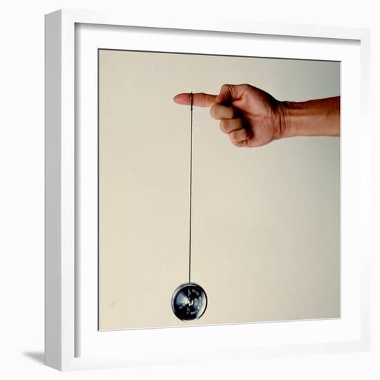 Hand Holding String Attached to Tom Khun Yo-Yos Ltd's High-Tech, Aluminum, Ball Bearing Yo-Yo-Ted Thai-Framed Photographic Print