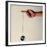 Hand Holding String Attached to Tom Khun Yo-Yos Ltd's High-Tech, Aluminum, Ball Bearing Yo-Yo-Ted Thai-Framed Photographic Print