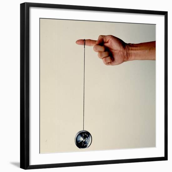 Hand Holding String Attached to Tom Khun Yo-Yos Ltd's High-Tech, Aluminum, Ball Bearing Yo-Yo-Ted Thai-Framed Photographic Print