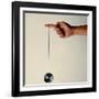 Hand Holding String Attached to Tom Khun Yo-Yos Ltd's High-Tech, Aluminum, Ball Bearing Yo-Yo-Ted Thai-Framed Photographic Print