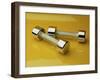 Hand Weights on a Reflective Yellow Surface-null-Framed Photographic Print