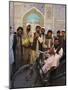 Handicapped Man Sitting in Special Modified Bike Surrounded by Men Outside Shrine of Hazrat Ali-Jane Sweeney-Mounted Photographic Print