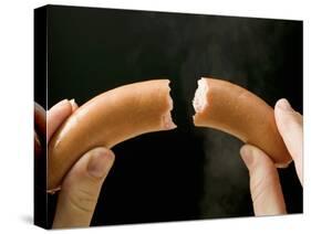 Hands Holding a Halved Frankfurter-null-Stretched Canvas