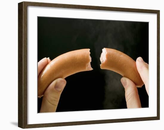 Hands Holding a Halved Frankfurter-null-Framed Photographic Print