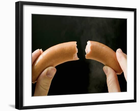 Hands Holding a Halved Frankfurter-null-Framed Photographic Print