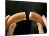 Hands Holding a Halved Frankfurter-null-Mounted Photographic Print