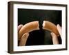 Hands Holding a Halved Frankfurter-null-Framed Photographic Print