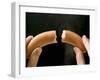 Hands Holding a Halved Frankfurter-null-Framed Photographic Print