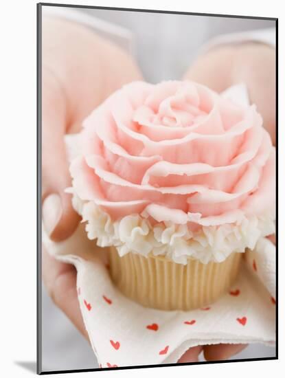 Hands Holding Cupcake with Marzipan Rose-null-Mounted Photographic Print