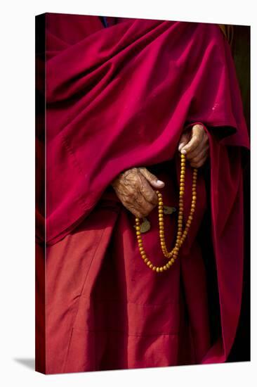 Hands of a Monk in Red Holding Prayer Beads, Leh, Ladakh, India-Ellen Clark-Stretched Canvas